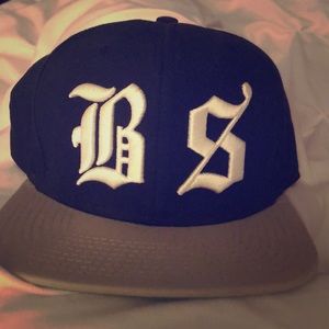 Undefeated snap back BS hat.